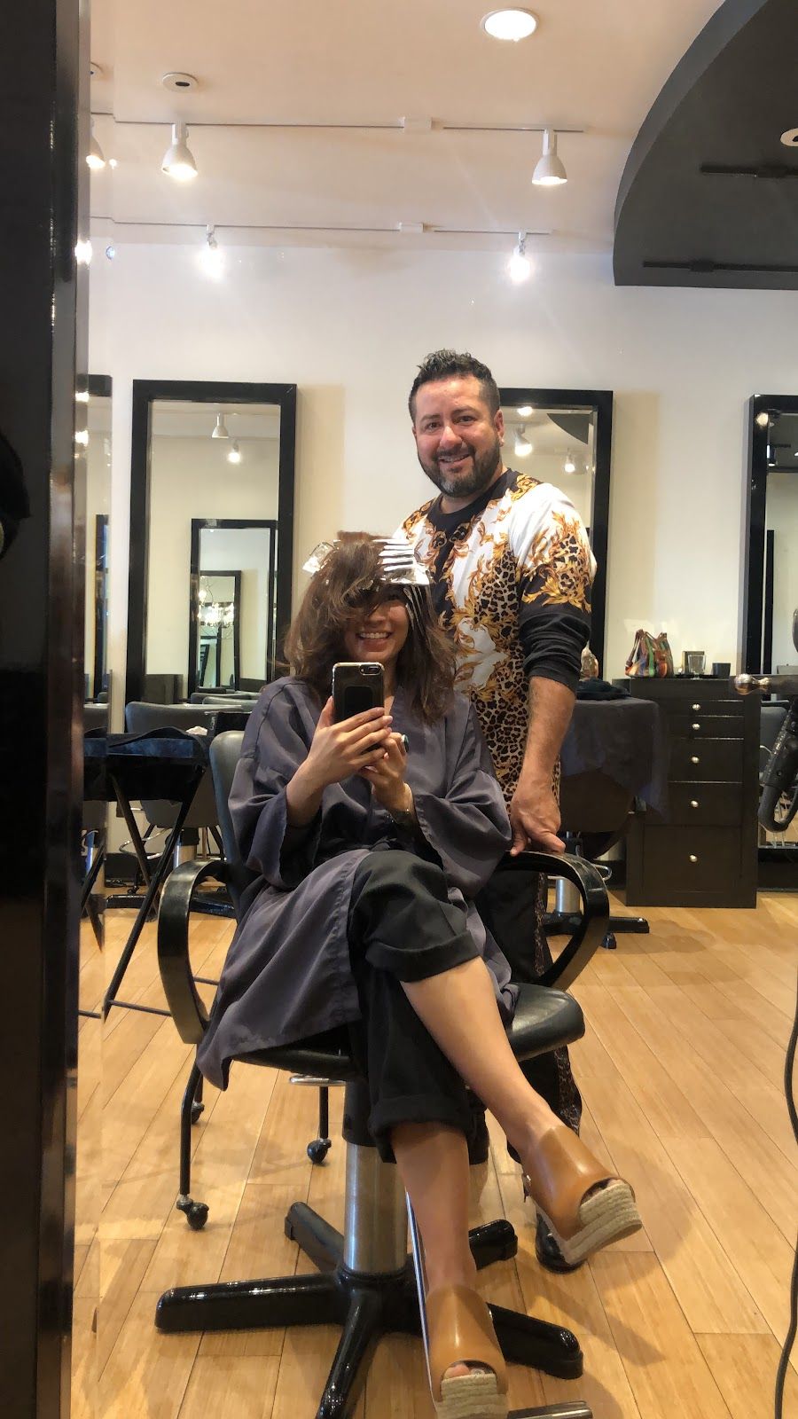 Louis Tafolla with a client at his Mira Mesa studio