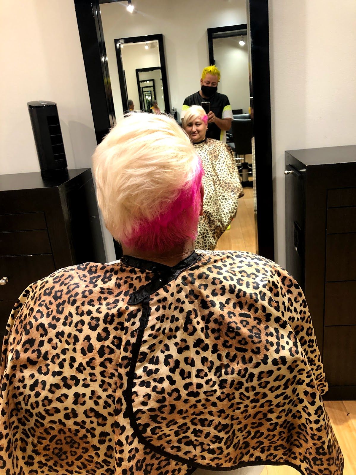 Vivid blonde and pink hair color by Louis Tafolla